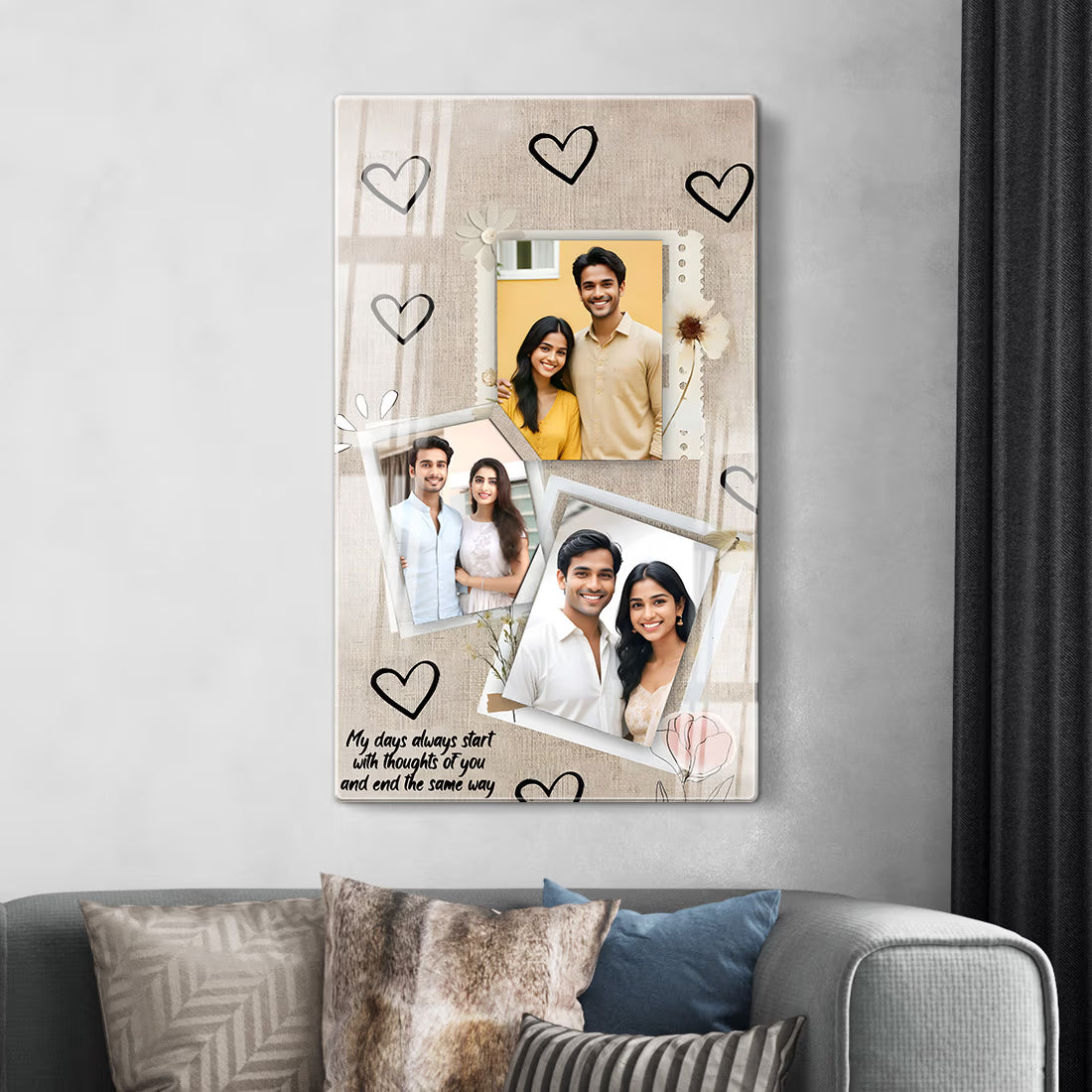 A vertical canvas wall art print featuring a collage of three couple photos, hand-drawn black hearts, and a sentimental quote on a beige linen-textured background, hanging on a light gray wall above a sofa with patterned cushions.