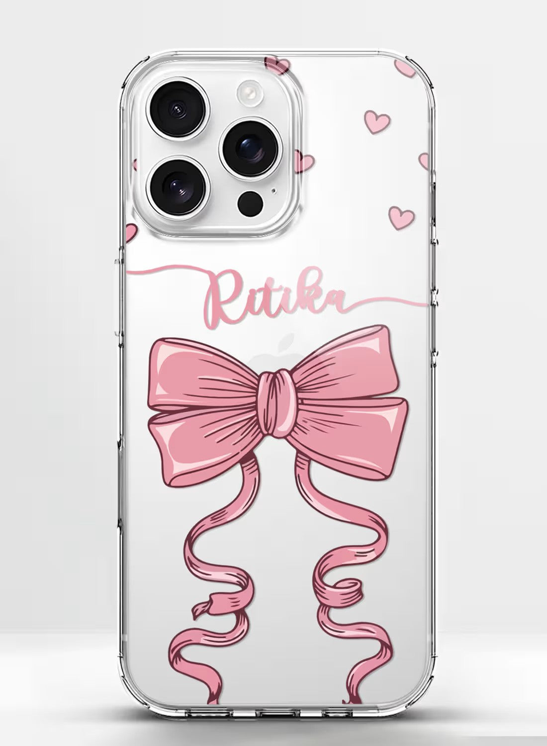 Custom name phone cover featuring a pink ribbon and hearts design on a clear silicone case for iPhone.