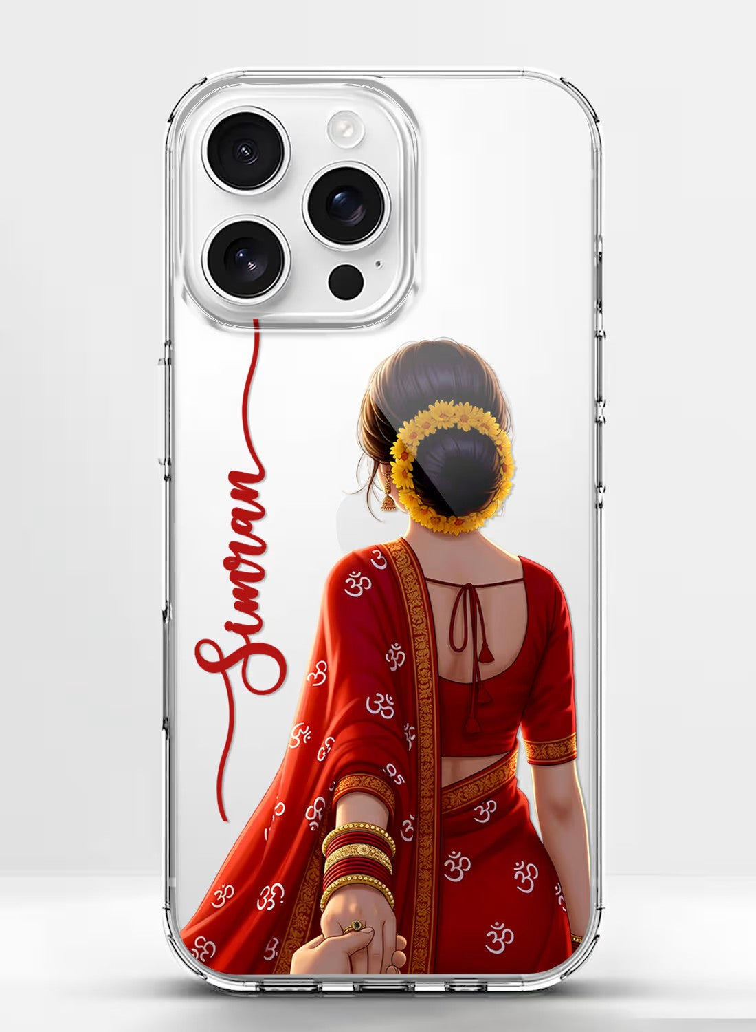 Personalized clear phone case featuring a woman in a traditional red saree with Om symbols and floral bun hairstyle.