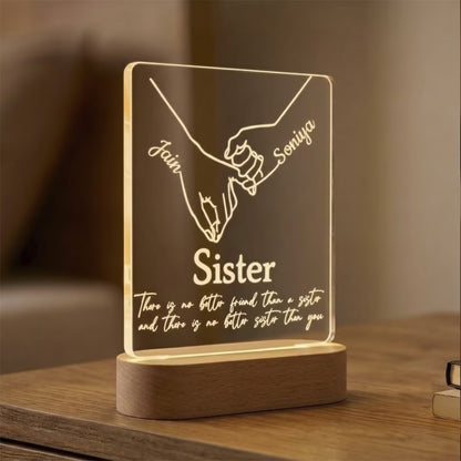 Custom acrylic LED photo frame with Amit and Sakshi names, pinky promise hands and sister quote for Rakhi gift