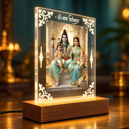 Shiv Parivar acrylic LED table lamp with Om Namah Shivay design and warm glow on wooden stand – Fashionury