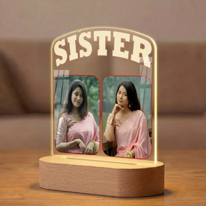 Side View of Sister custom 2 photo acrylic LED lamp with bold typography on wooden base
