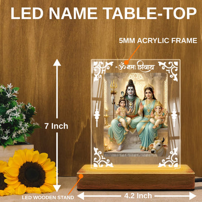 Shiv Parivar acrylic LED table lamp with Om Namah Shivay design and warm glow on wooden stand – Fashionury