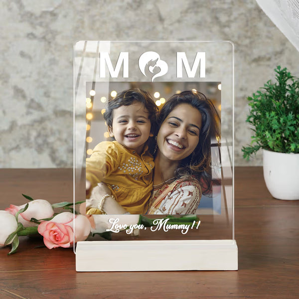 Personalised photo frame with a mother and daughter photo on a wooden surface.