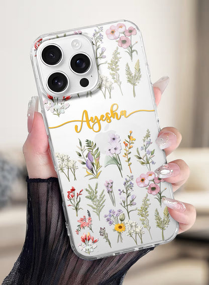 Clear silicone iPhone case featuring a delicate watercolor wildflower design with space for a custom name in gold script.