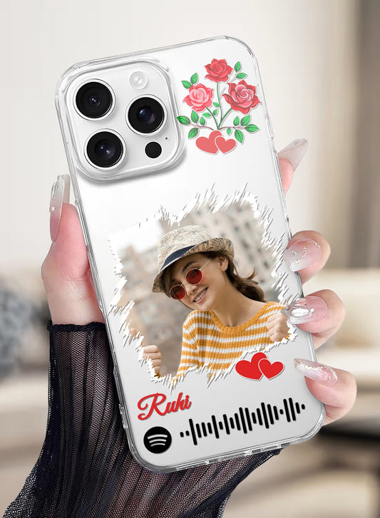 A personalized clear silicone phone case featuring a photo, rose art, hearts, and a customizable music scan code.
