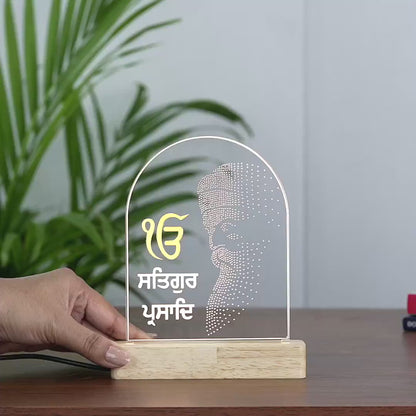 Video showing the divine silhouette of Satguru Prasad Ji on LED Lamp with wooden base and and arch shape