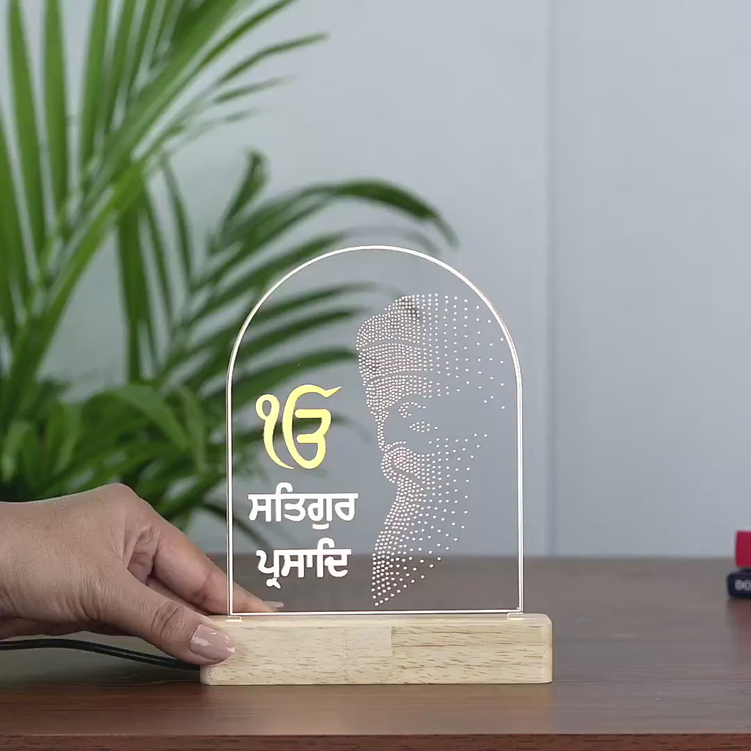 Video showing the divine silhouette of Satguru Prasad Ji on LED Lamp with wooden base and and arch shape