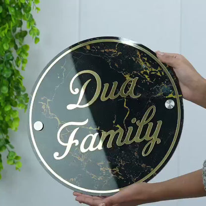 Wall mounted view of Personalized Black Marble Circle Name Plate for home entrance 