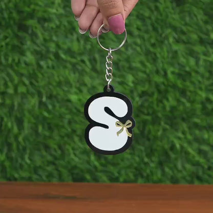 Close up Video of demonstrating how the Custom Letter Keychain looks on a handbag
