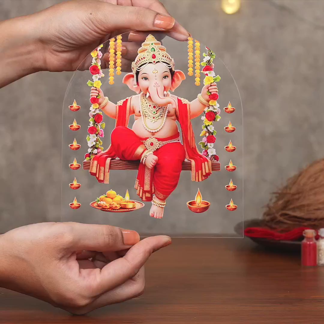 Showcase Video of Lord Ganesha on floral swing arch acrylic tabletop frame with wooden base – Ganesh Chaturthi decor by Fashionury