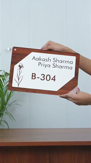 Showcase video of a household nameplate with a custom name and address on a door.